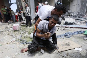 Man in Rafah after body of mother removed from rubble, 8-3-14
