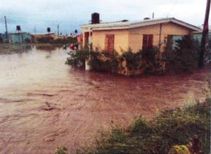 Image from internal USAID document. Caption reads: “Site flooding due to improper drainage.”
