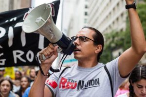Solidarity march against Dakota Access Pipeline in Chicago; Red Nation co-founder Nick Estes on bullhorn