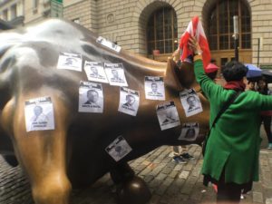 The group marched to the famous Bull of Wall Street, a symbol of corporate greed and U.S. imperialism in the heart of corporate America. They covered the bull in Puerto Rican flags and “Wanted” posters