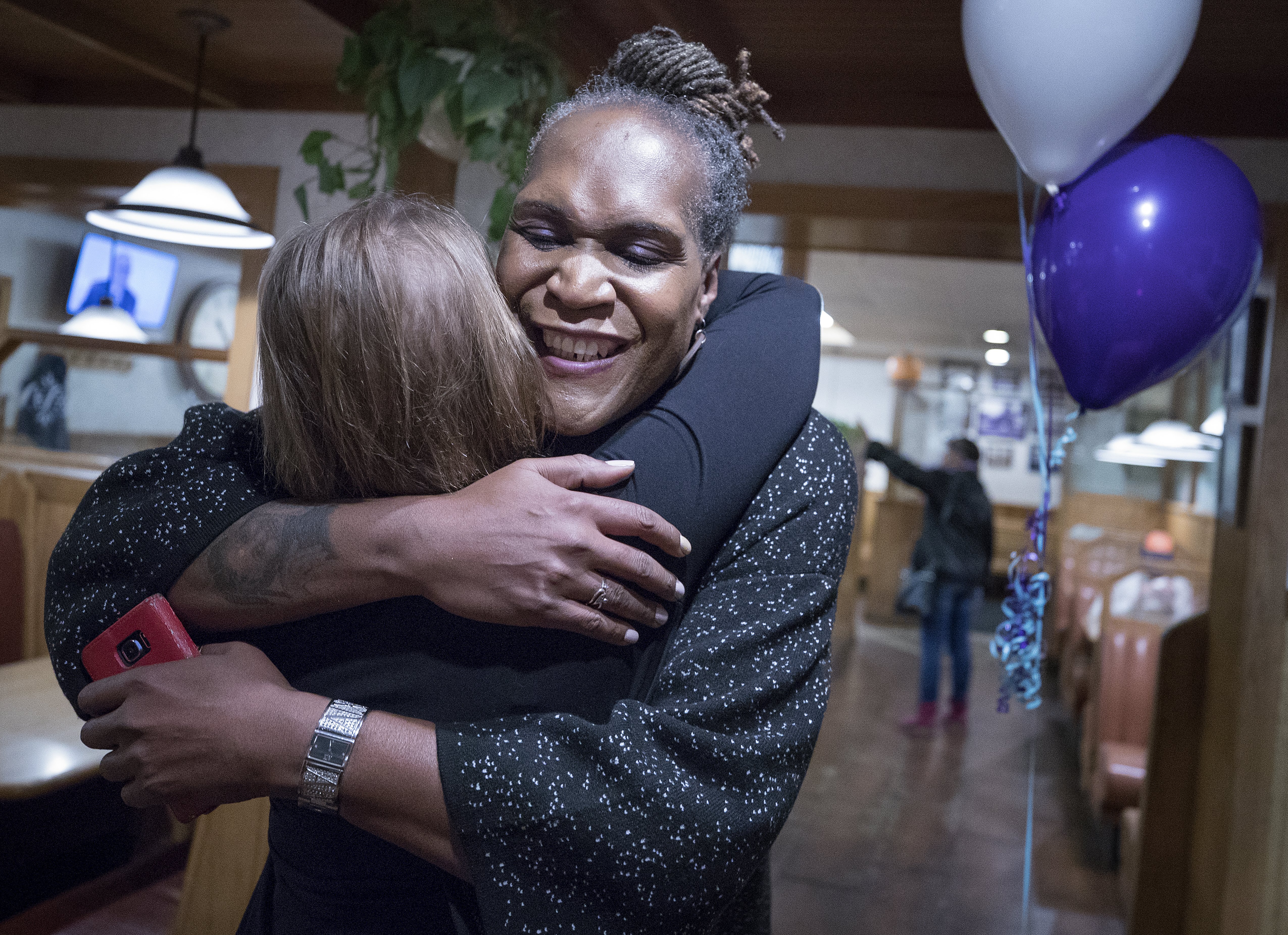 Andrea Jenkins hugs a supporter as she wins the Minneapolis Ward 8: Council Member race in Minneapolis.