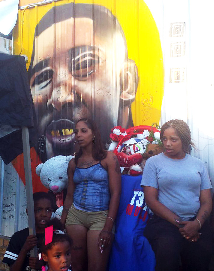 Liberation photo-Mural of Alton Sterling at the Triple S market, site of his killing.