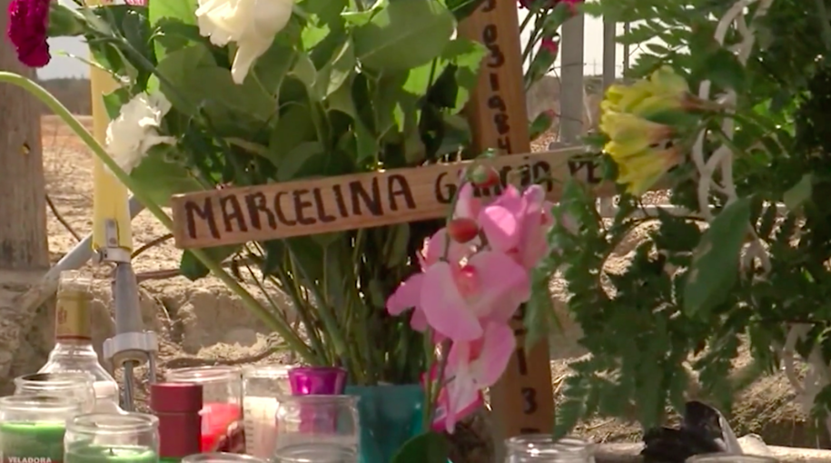 Roadside memorial for Santos Hilario Garcia and Marcelina Garcia-Perfecto. Screen shot of KGET footage.