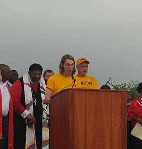 Cortne Duval (at podium) and Rev. Barber (left). Liberation Photo: Sarah Sloan
