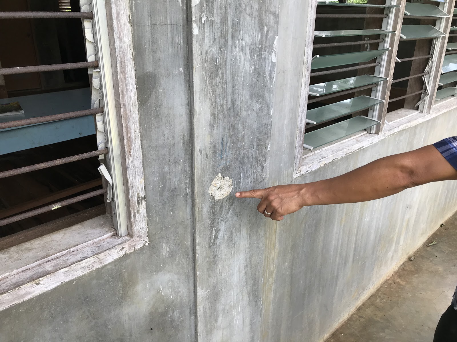 One of many bullet holes that remain in a Lumad indigenous school after the Lianga Massacre, carried out by paramilitaries and the Armed Forces of the Philippines, funded by U.S. tax dollars. -Liberation News Photo