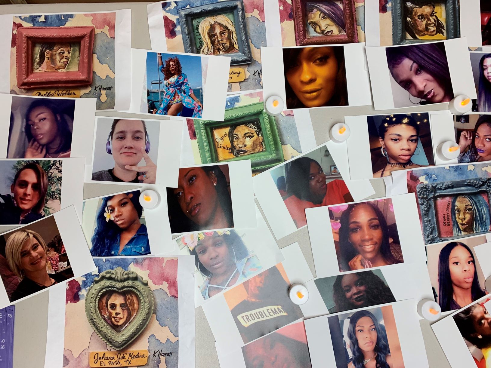 Pcitures of Transgender people murdered in the United States in the year 2018-2019 are pinned to an off-white wall
