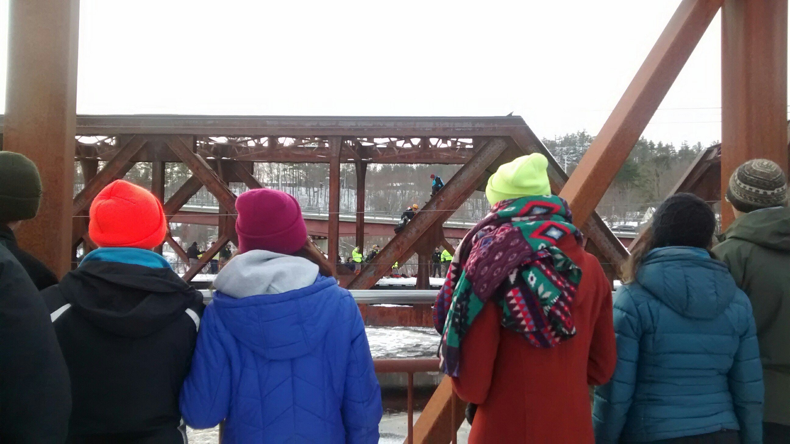 Supporters watch activists shut down a bridge in New Hampshire.