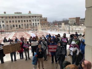 Activists gather outside the Rhode Island State House in Providence. 