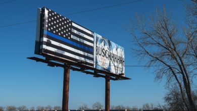 A billboard along US Route 10 in Dilworth, Minnesota has a 'Thin Blue Line' or 'Blue Lives Matter' flag and an advertisement for Busch beer...- .© 2018 Tony Webster .tony@tonywebster.com .+1 202-930-9200