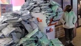 COVID tests piled up outside a FedEx drop-off box in Chicago. Photo credit: Reds in Ed