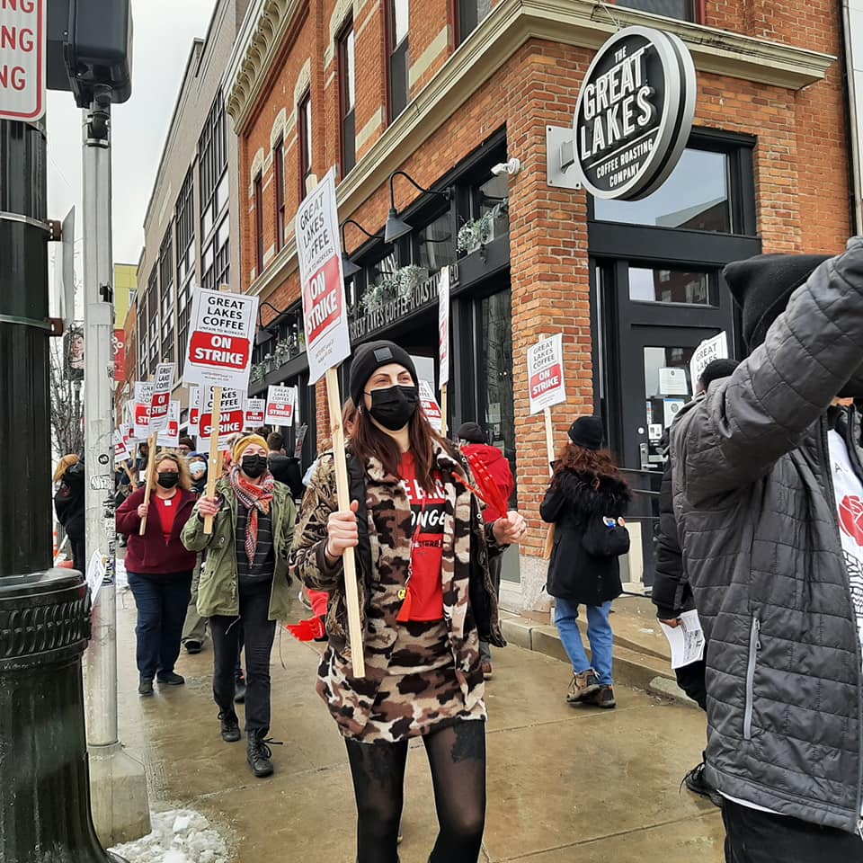 Workers and supporters march in front of the Great Lakes Coffee shop in Midtown Detroit. Liberation photo