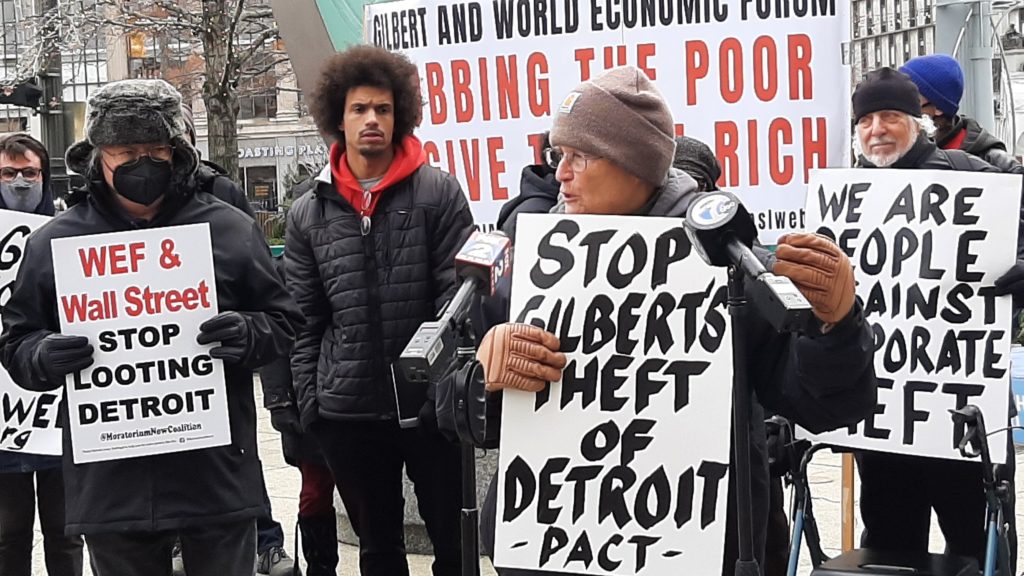 Protesters rally across the street from billionaire Dan Gilbert's Detroit headquarters, to decry robbing the poor to give to the rich, on Oct. 25, 2021. Liberation photo
