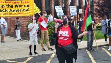 Protestors outside the Flossmoor Village Hall before the Village Board meeting on Aug. 15, 2022. Liberation photo