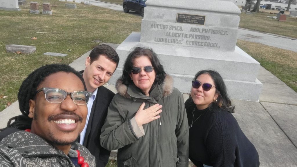 David Ramirez and Lianys Torres Rivera (center) visit the Haymarket martyrs' memorial in Chicago with PSL's Nino Brown, who provided security, and Eli Gallegos, who drove the dignitaries. Liberation photo